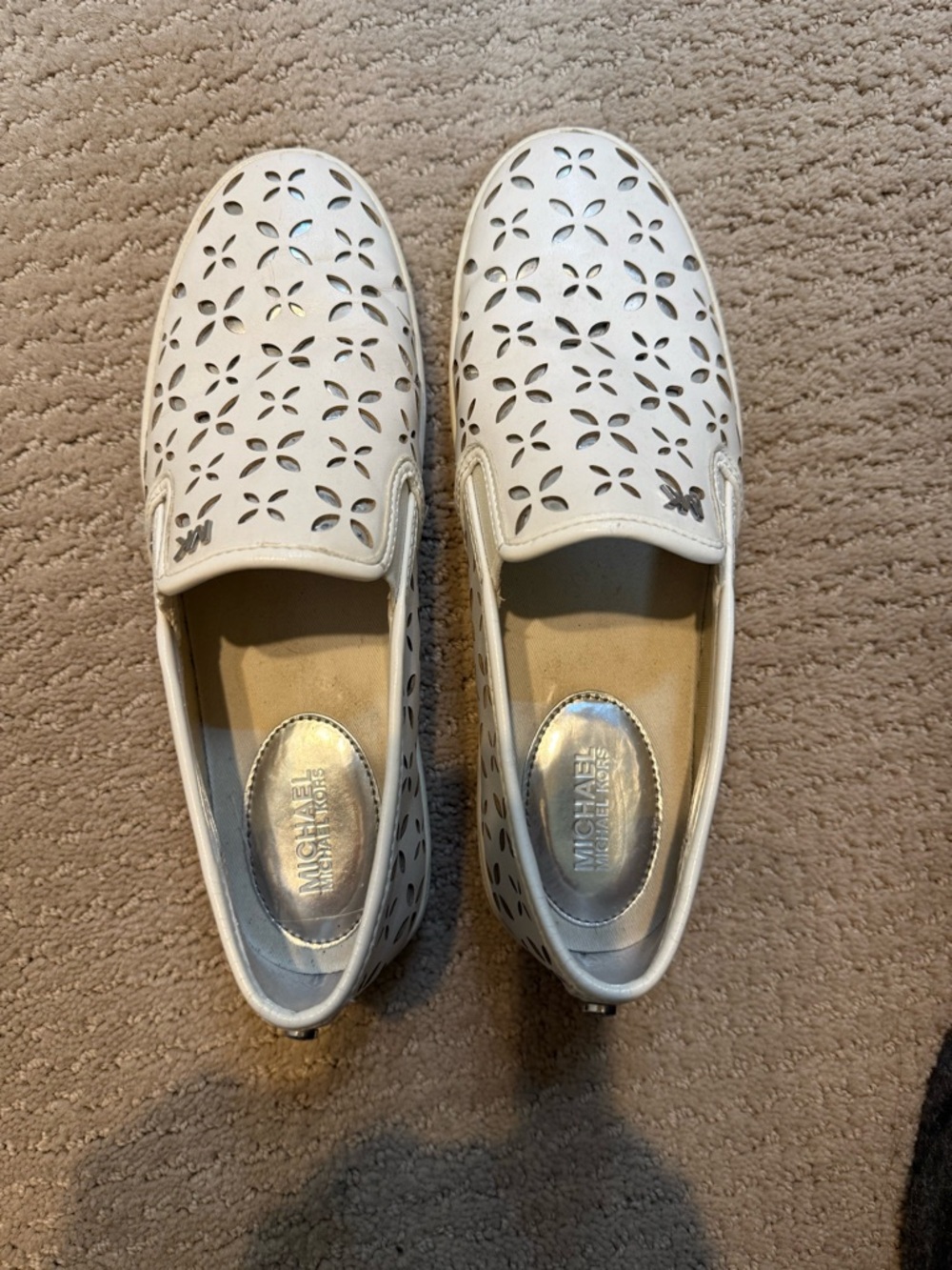 MICHAEL Michael Kors White Perforated Slip-On Loafers.  Silver lining.